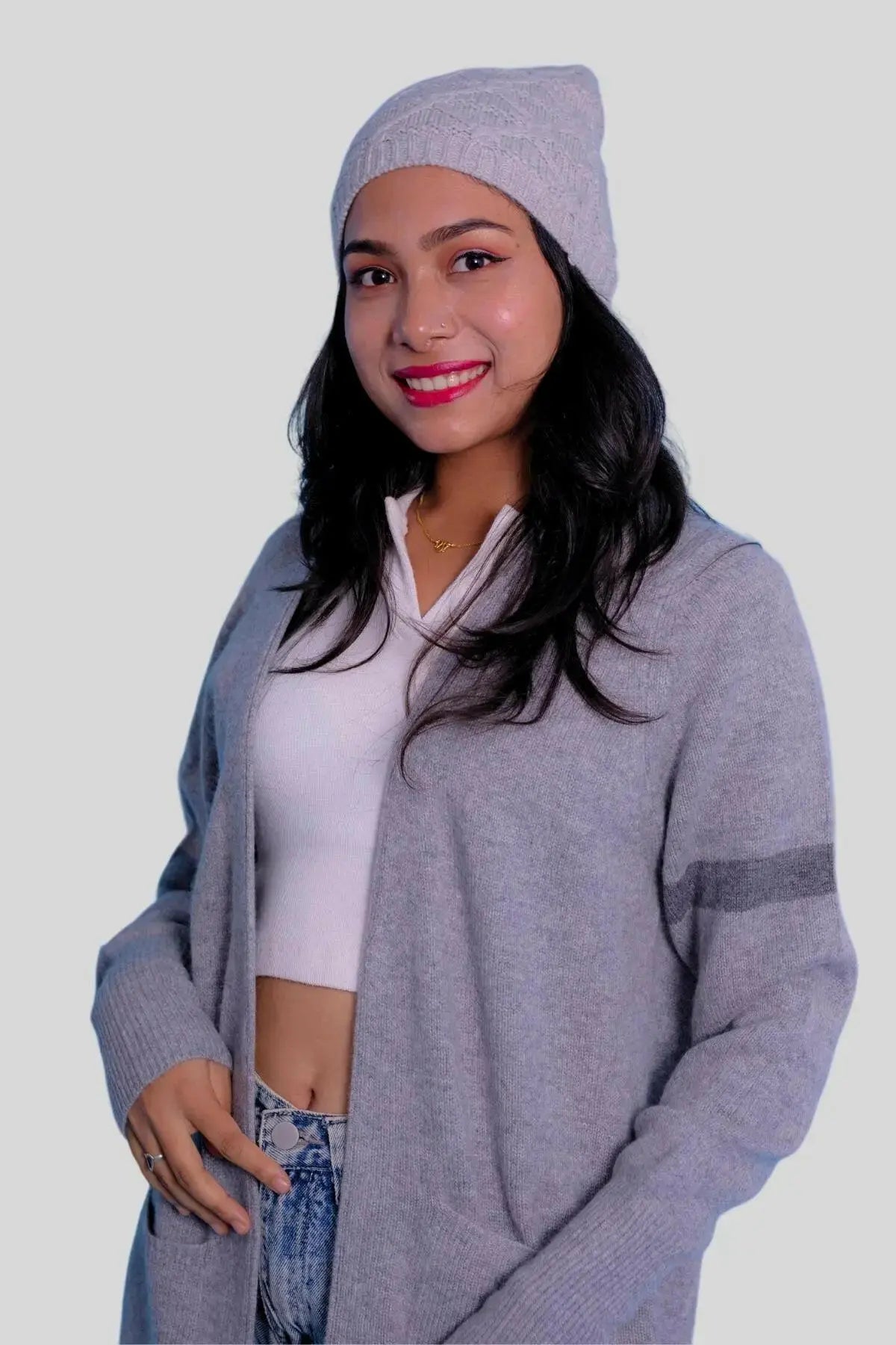 Luxury Italian cashmere hat with woman in grey cardigan and jeans