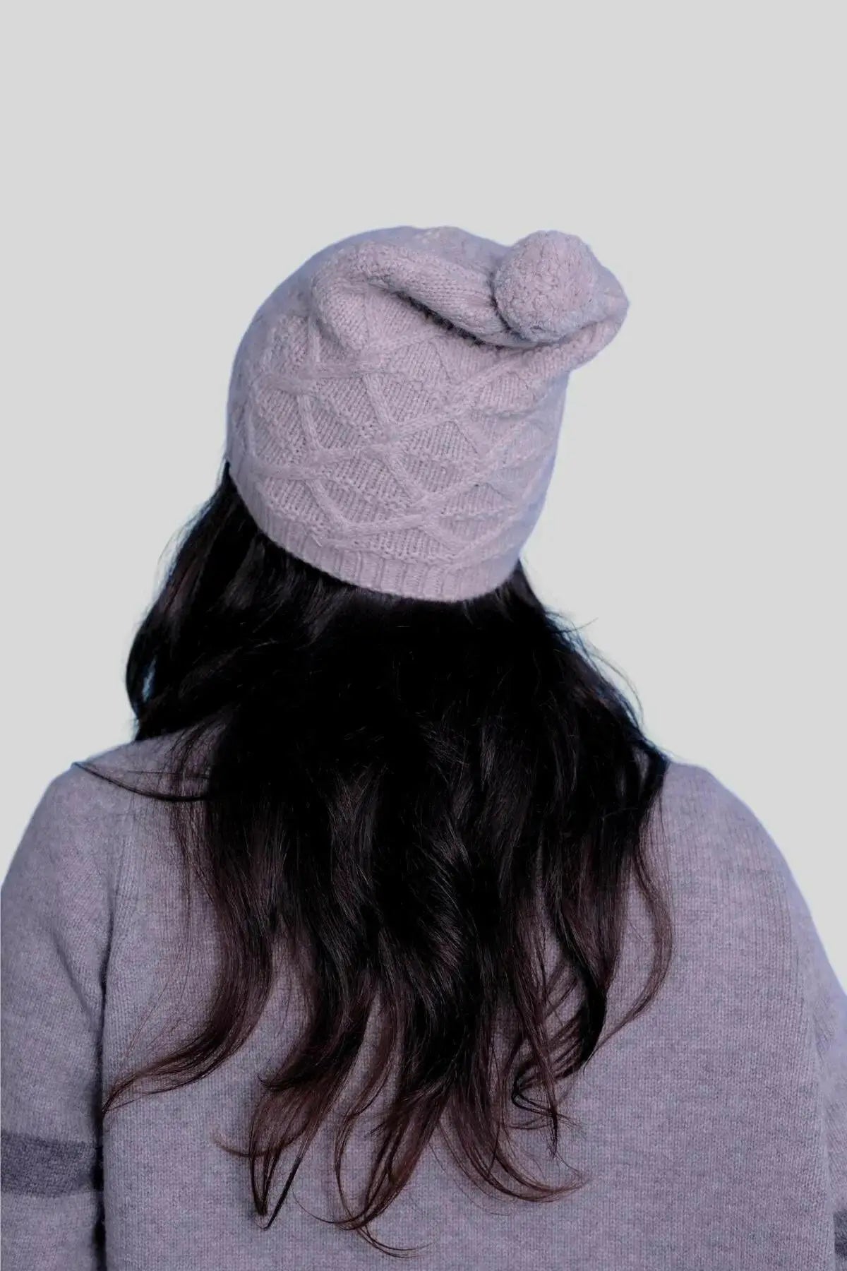 Luxury Italian Cashmere Pompom Hat - Woman with long hair wearing a grey hat