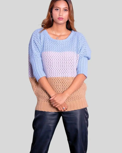 Luxury Italian Cashmere Pullover showcasing a woman in blue sweater and black pants