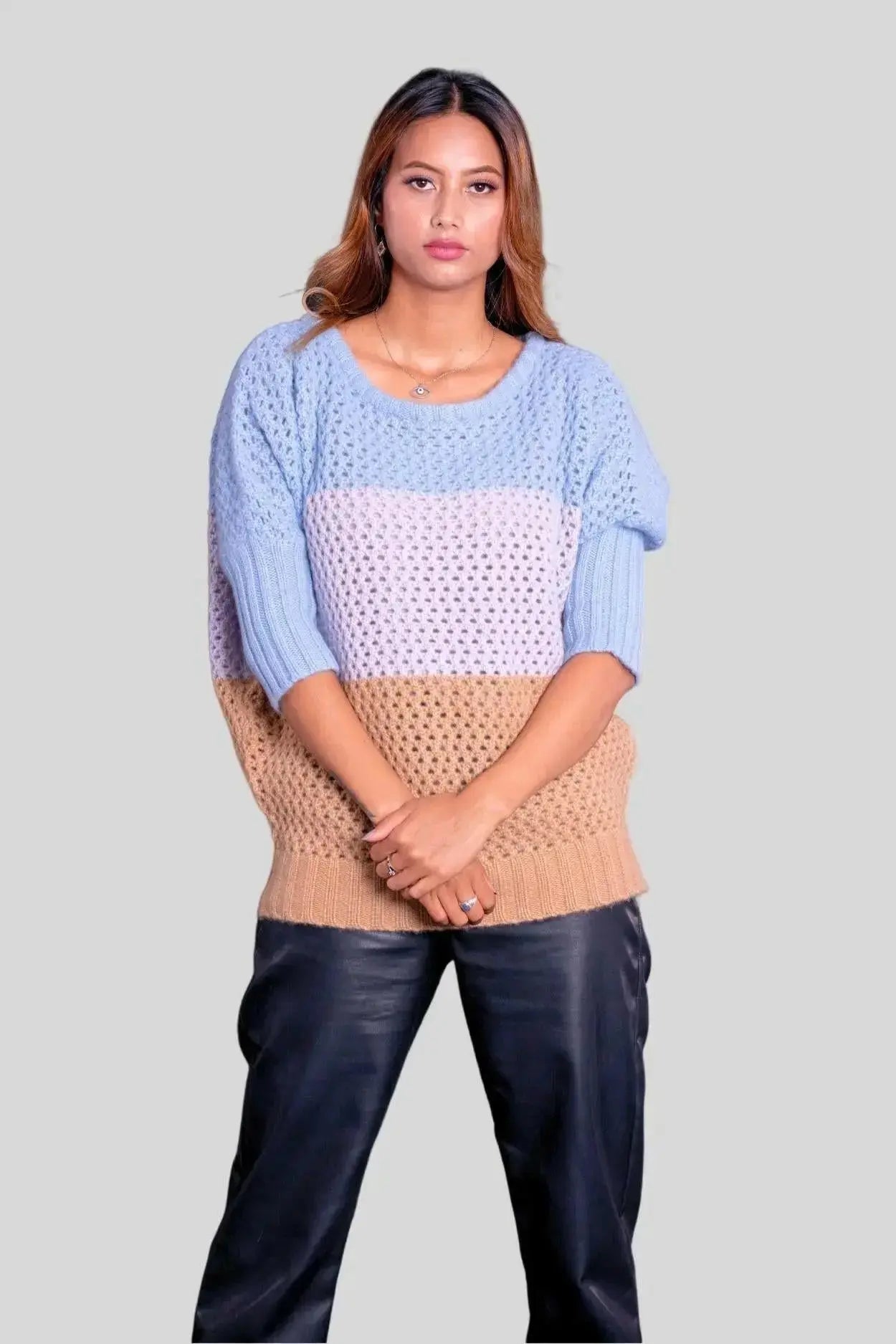 Luxury Italian Cashmere Pullover showcasing a woman in blue sweater and black pants