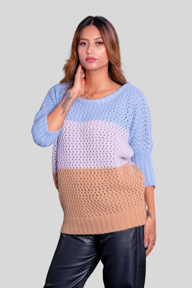 Luxury Italian Cashmere Pullover worn by woman in blue and beige sweater