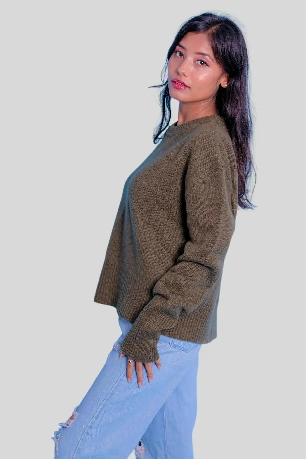 Luxury Italian Cashmere Sweater - Woman in Green Sweater and Jeans