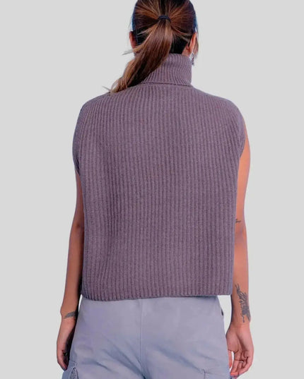 Woman wearing a purple turtle neck ribbed sweater vest from Luxury Italian Cashmere