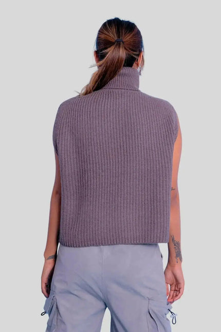 Woman wearing a purple turtle neck ribbed sweater vest from Luxury Italian Cashmere