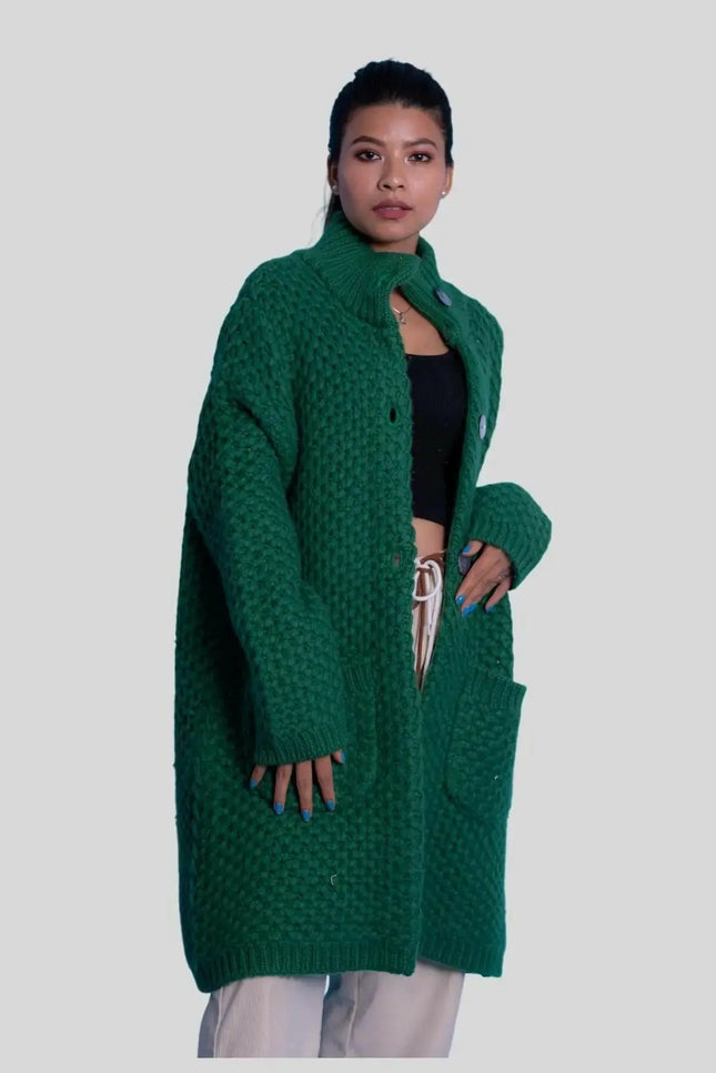 Woman wearing moss stitch heavy cardigan in green cable knit coat | KCI 263