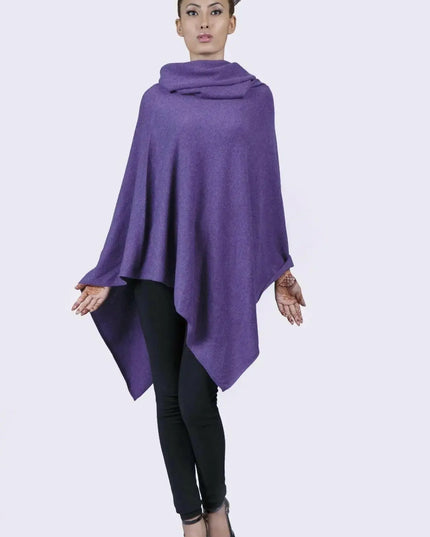 Woman wearing a purple Turtle Neck Poncho with black leggings