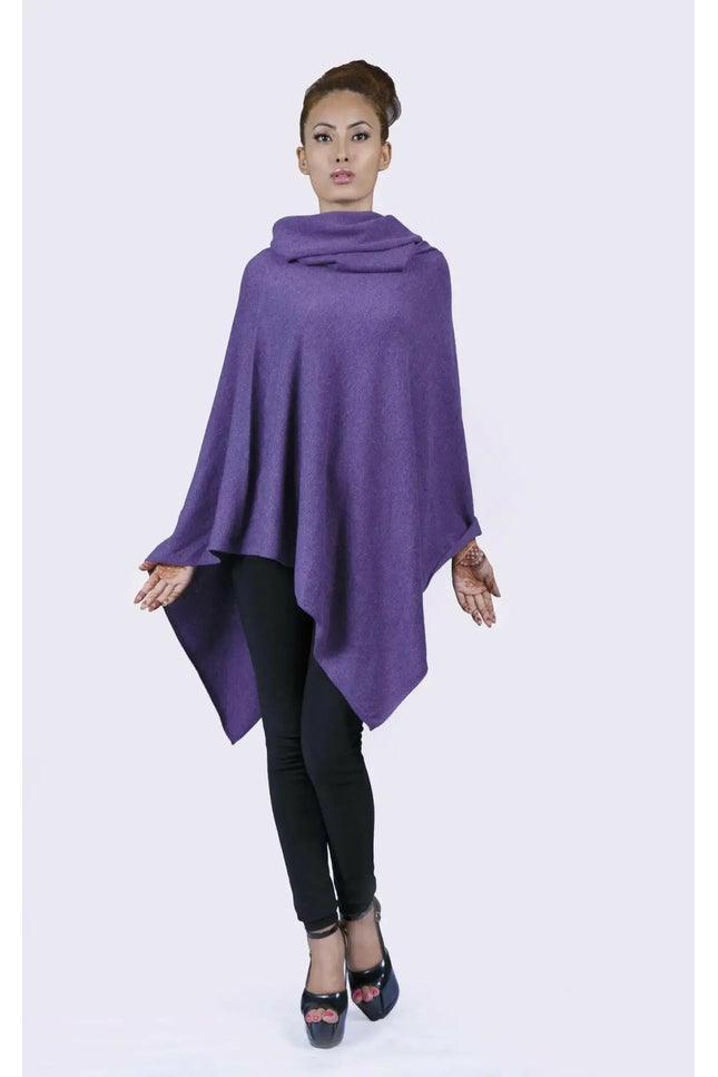 Woman wearing a purple Turtle Neck Poncho with black leggings