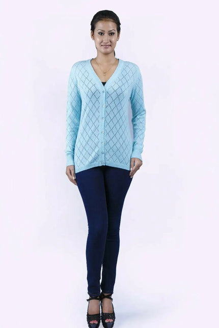 Woman in blue sweater and jeans wearing Women’s Diamond Pointelle Cashmere Cardigan with V-neck design