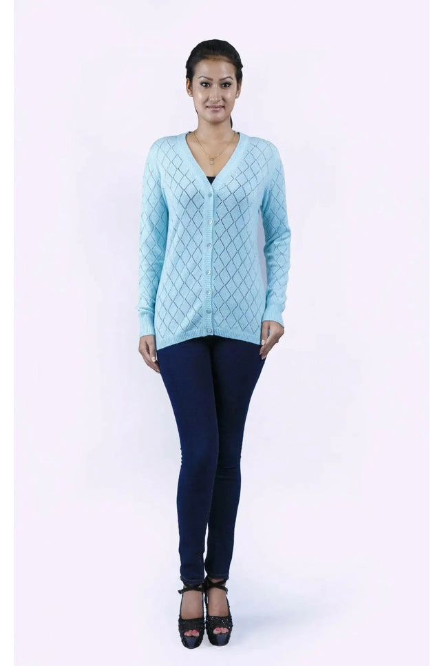 Woman in blue sweater and jeans wearing Women’s Diamond Pointelle Cashmere Cardigan with V-neck design